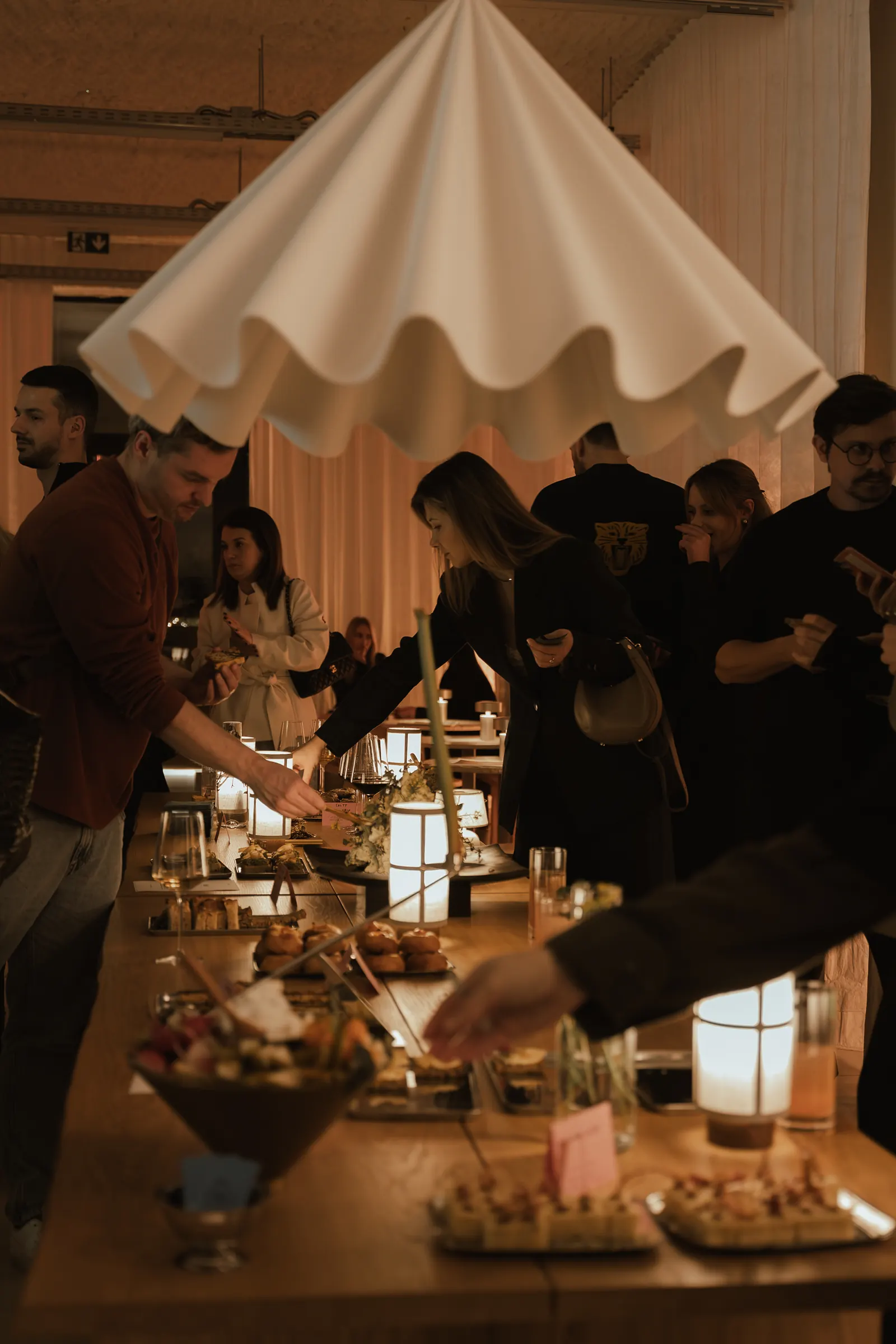The bar counter set with lamps and food during a brand night