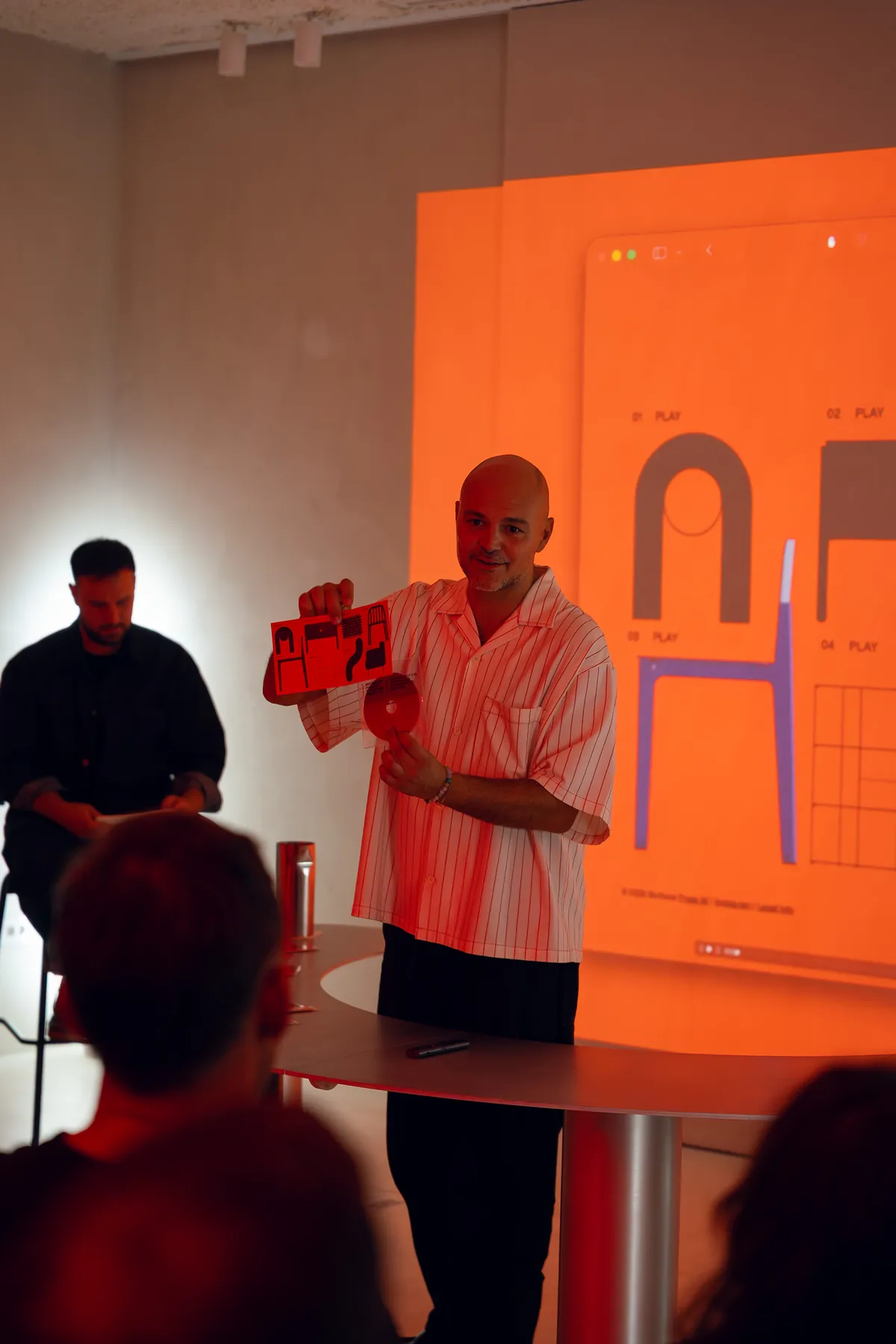 Daniele holding the Bottone record released with the collection