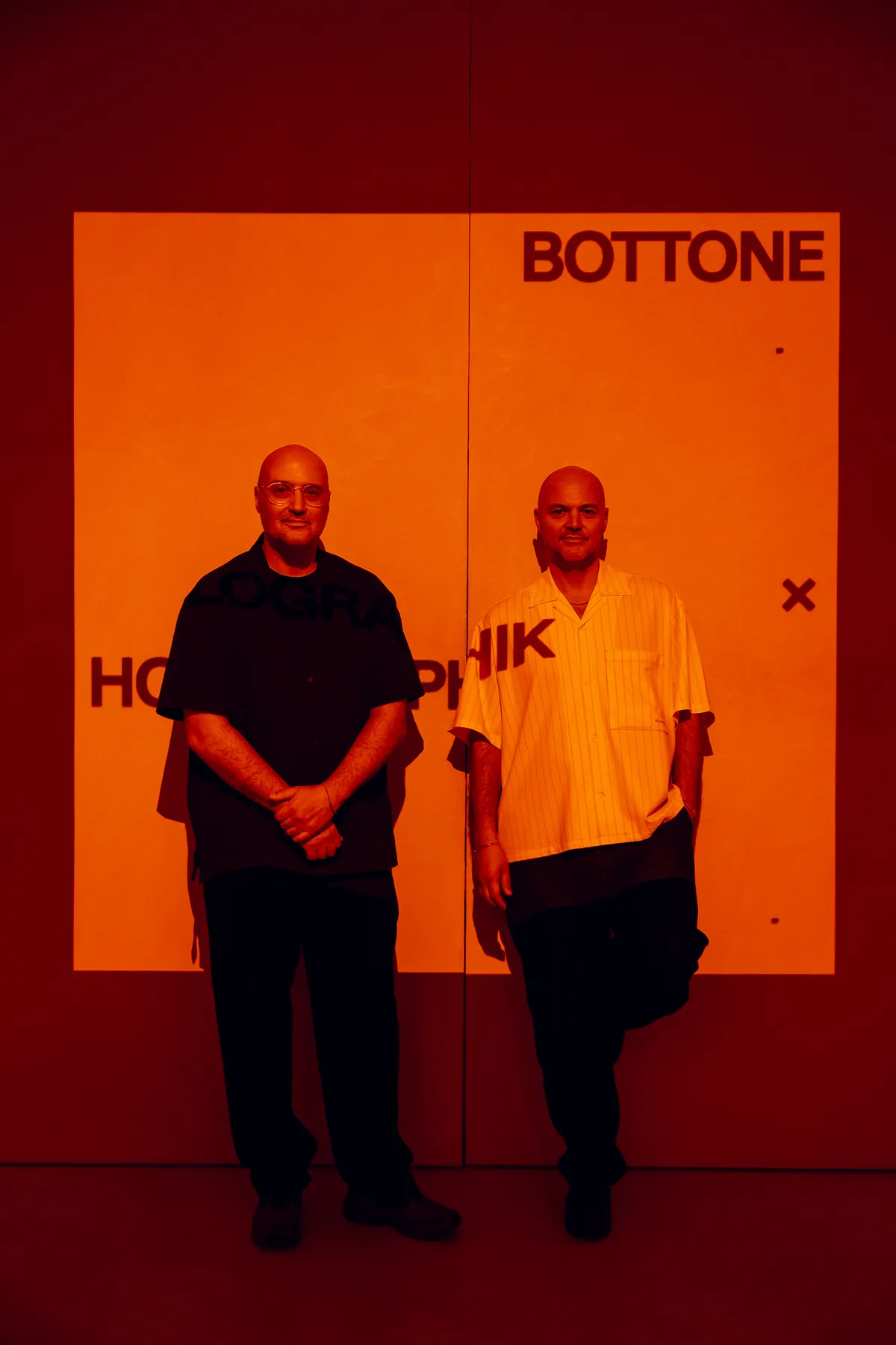 Michele and Daniele in front of the projected identity
