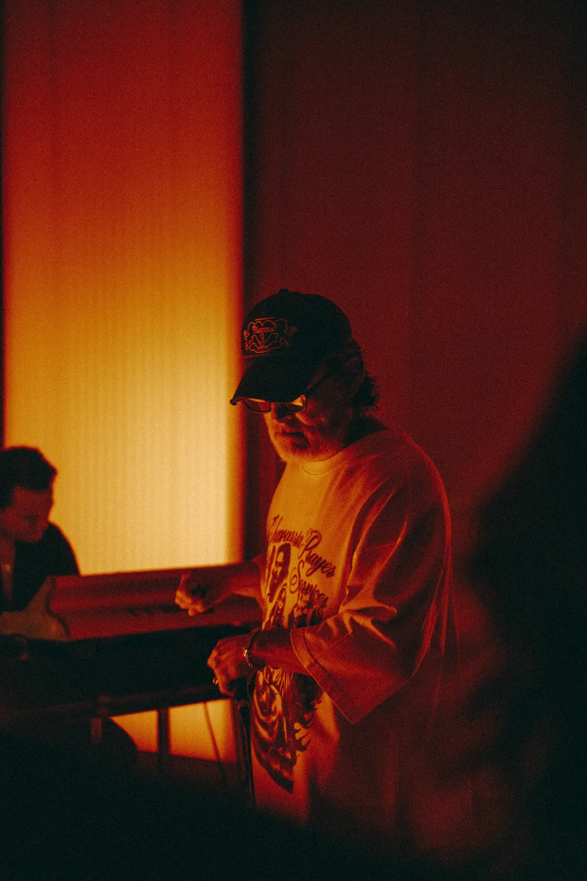 Eddie Chacon on the microphone, John Carroll Kirby at the keys behind him