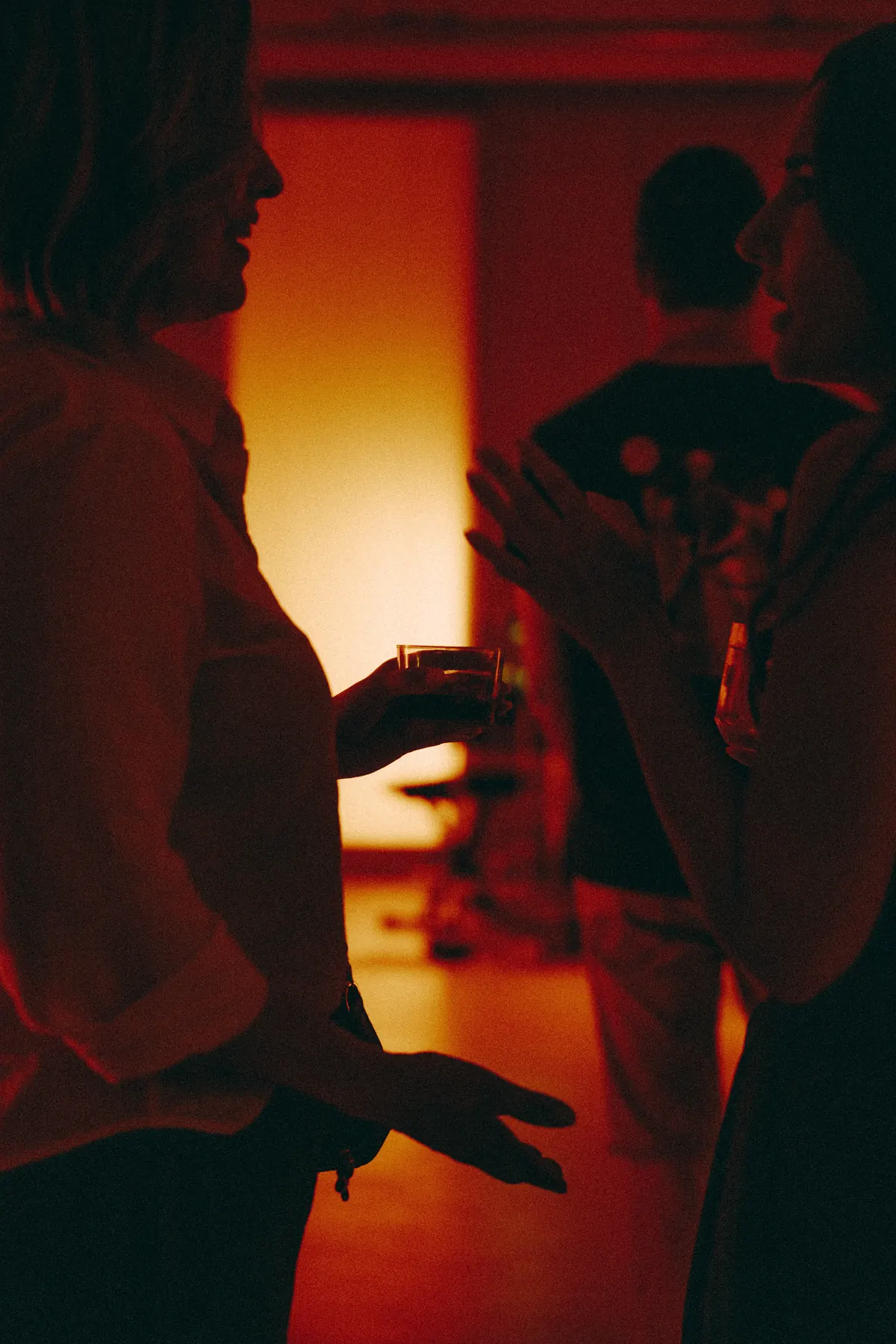 Guests talking in the main room after the set