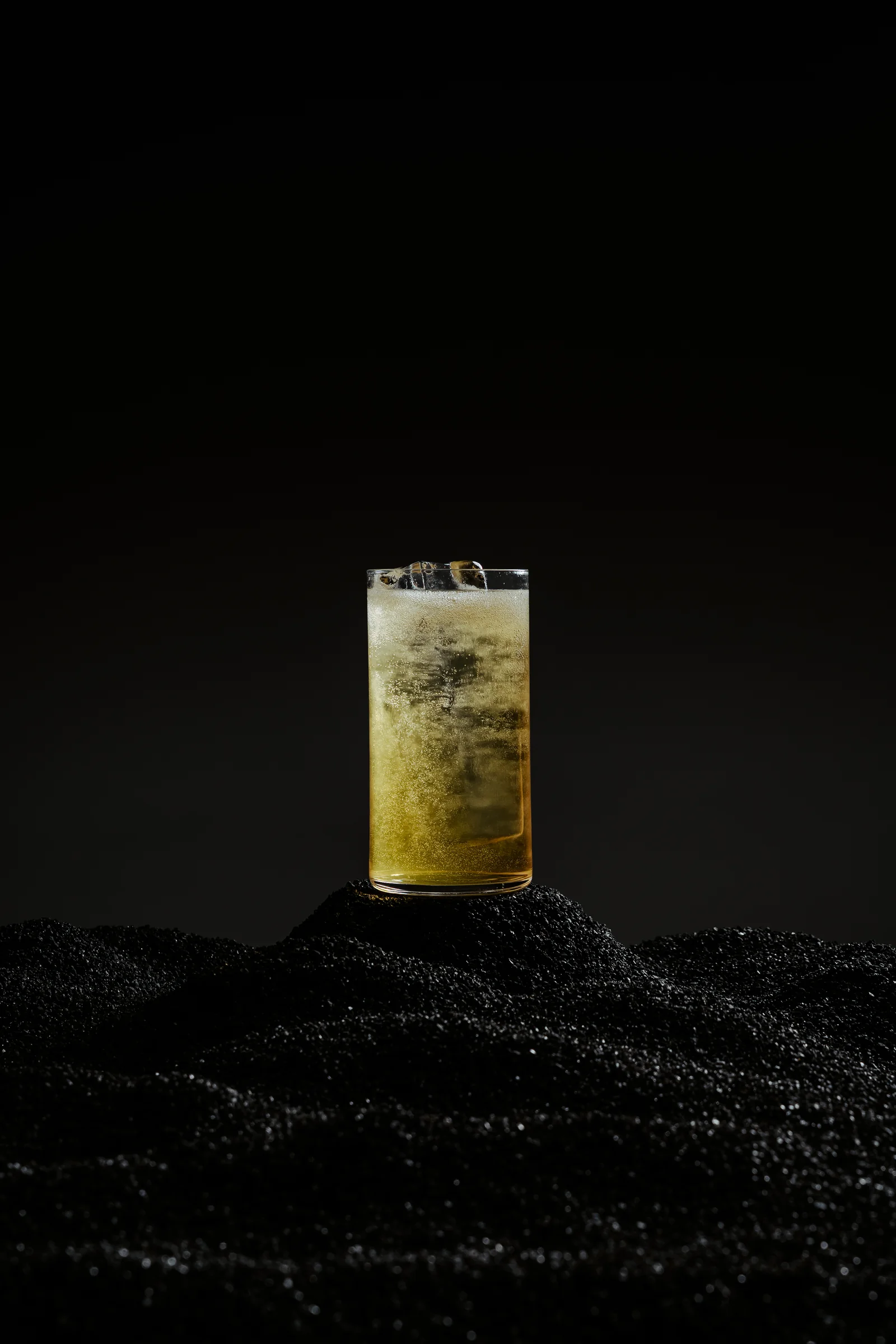 Overlay, cachaça and sake highball with genmaicha, turmeric and aloe water