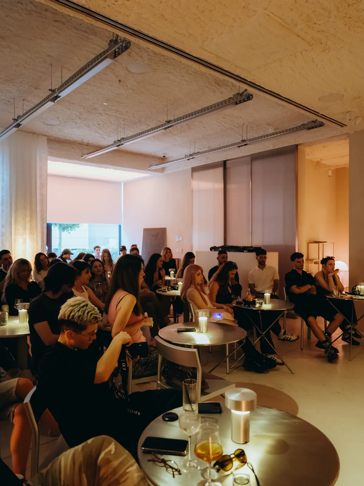 Guests listening at the tables during Fashion Talks
