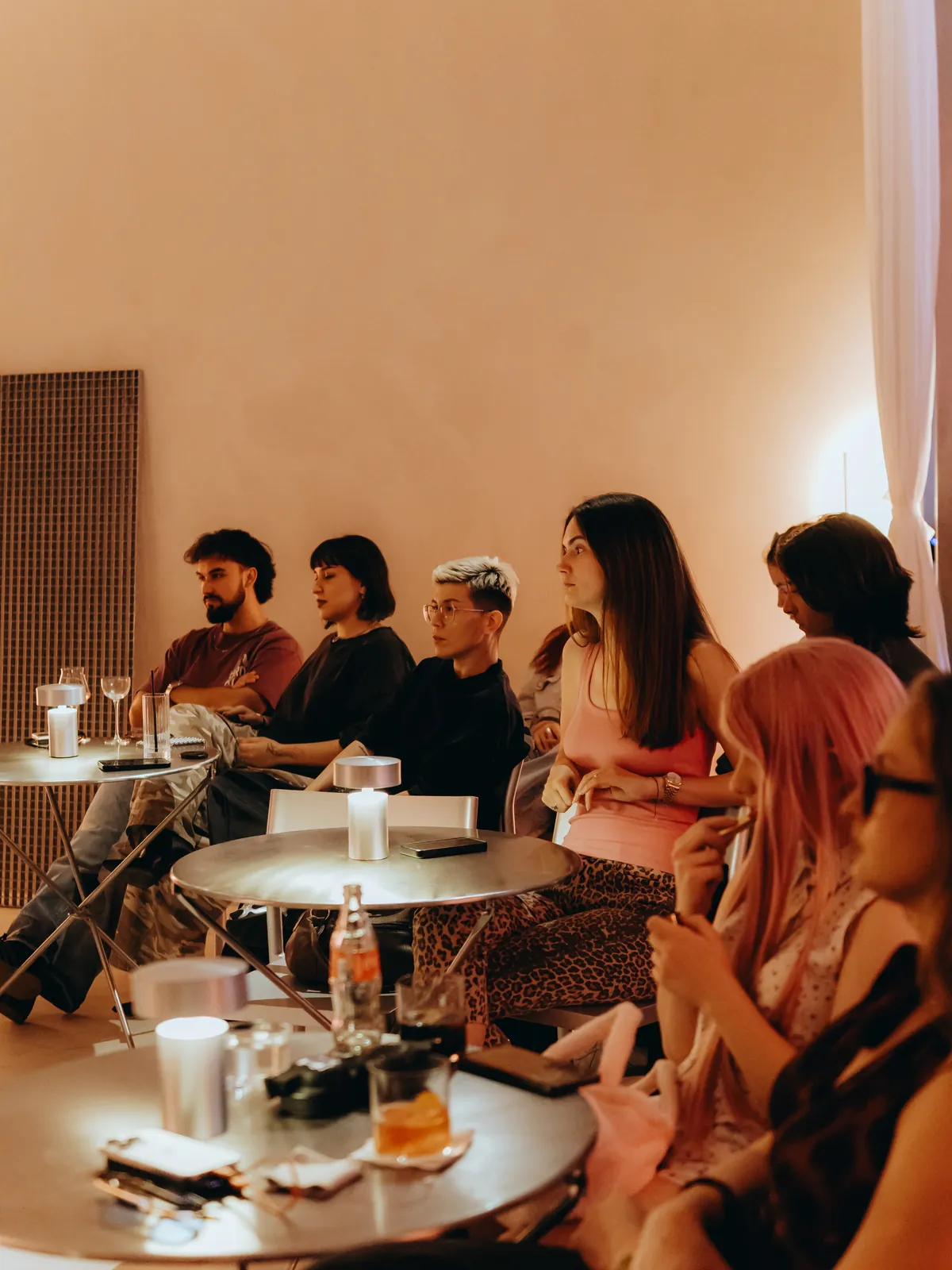 Drinks on the tables in the audience at Fashion Talks