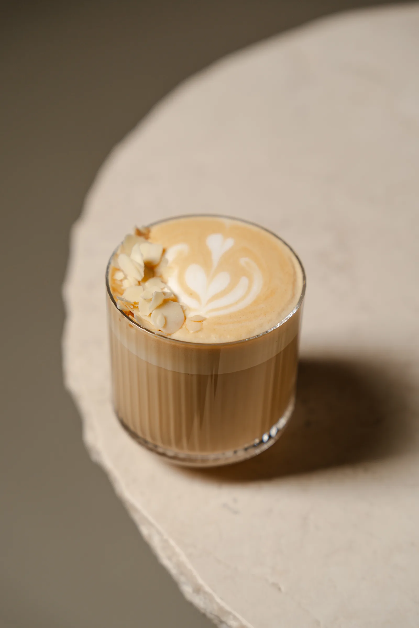 Pumpkin Coco Chili Latte from the winter daytime menu at Holographik Space, on the edge of a stone table