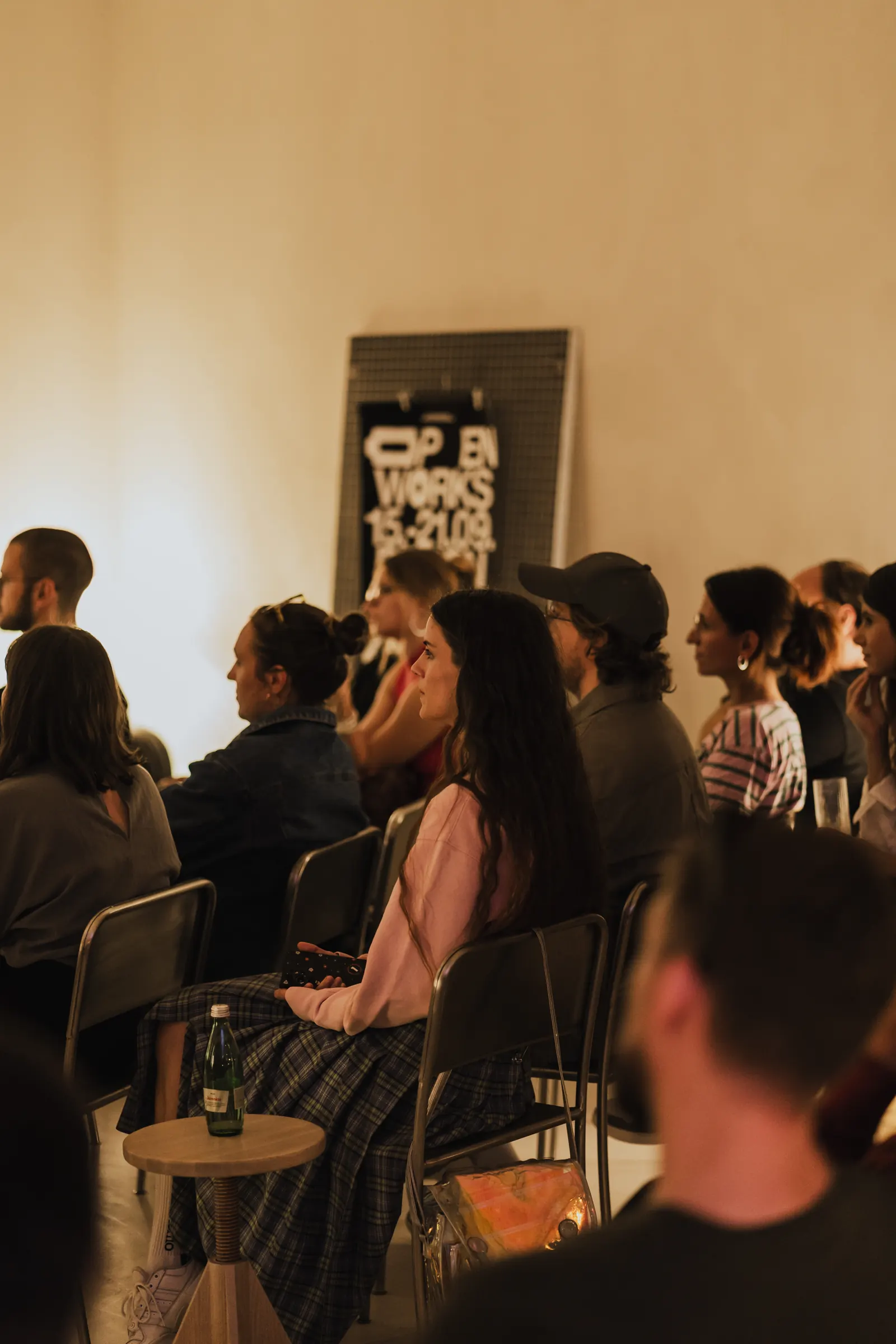 An audience watching a talk in the showroom zone